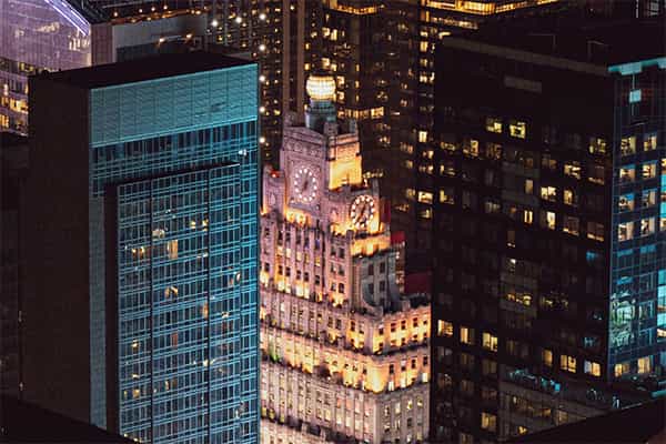 downtown office buildings illuminated at night
